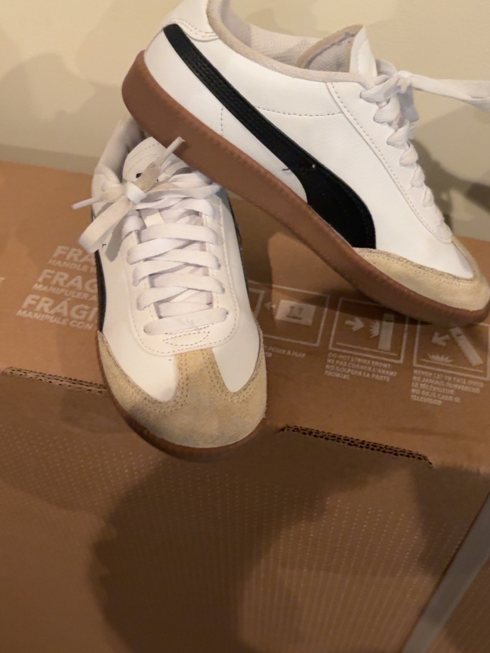 White Pumas with Black Stripe and Gum Sole